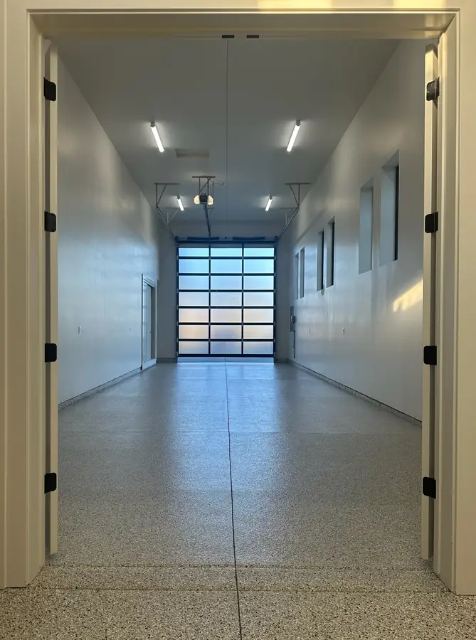 Hallway into a garage with a flake floor coating