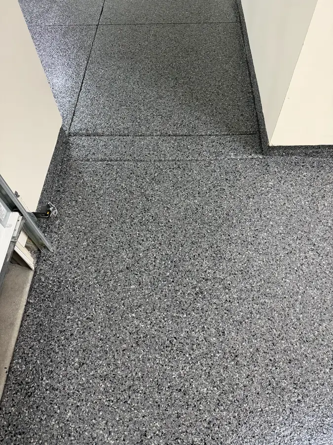 Flake floor at the garage door threshold