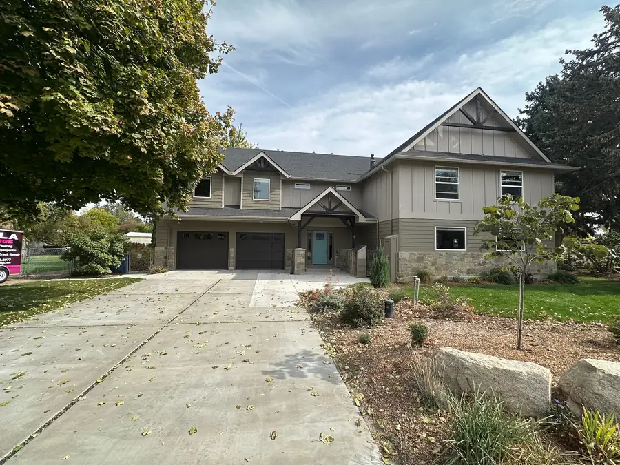 Front of a home with a wide concrete driveway