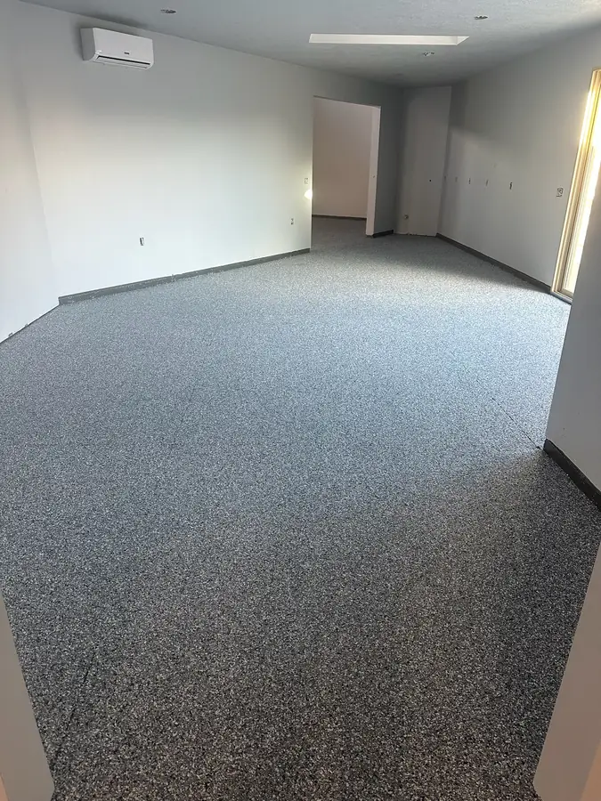 Flake floor leading into a side room