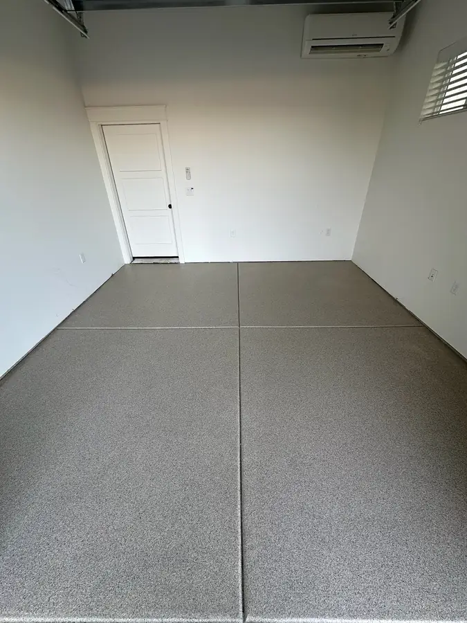 Gray flake garage floor with a side door