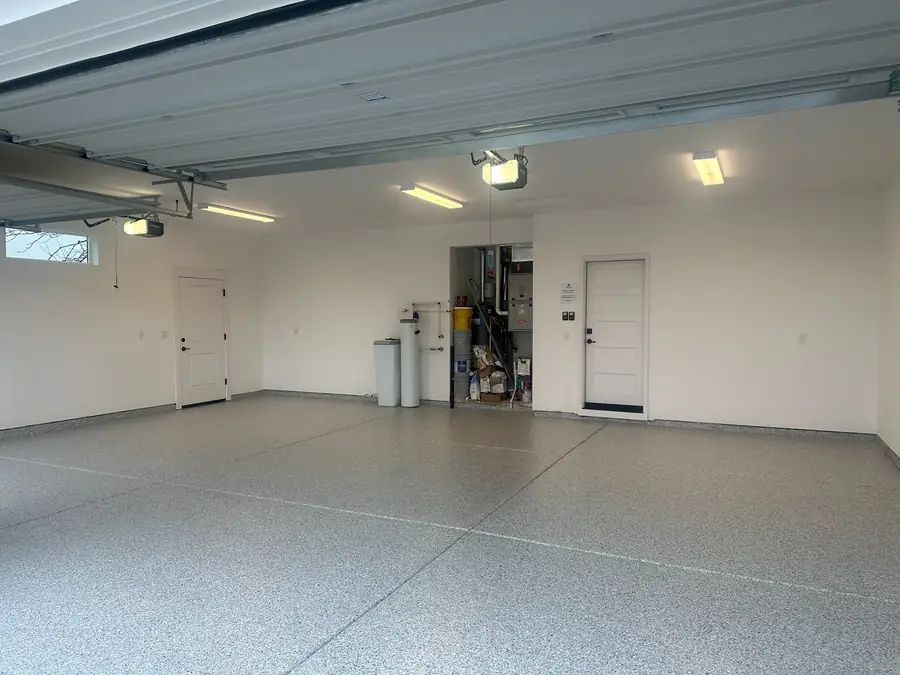 Garage floor coating with storage on the back wall