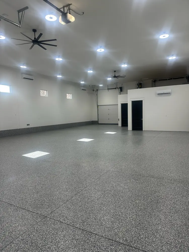 Bright shop floor with a light gray flake coating