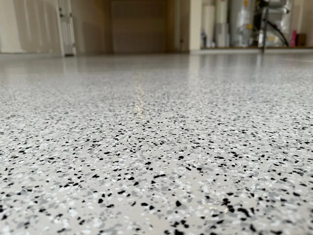 Close up of a full broadcast flake floor coating